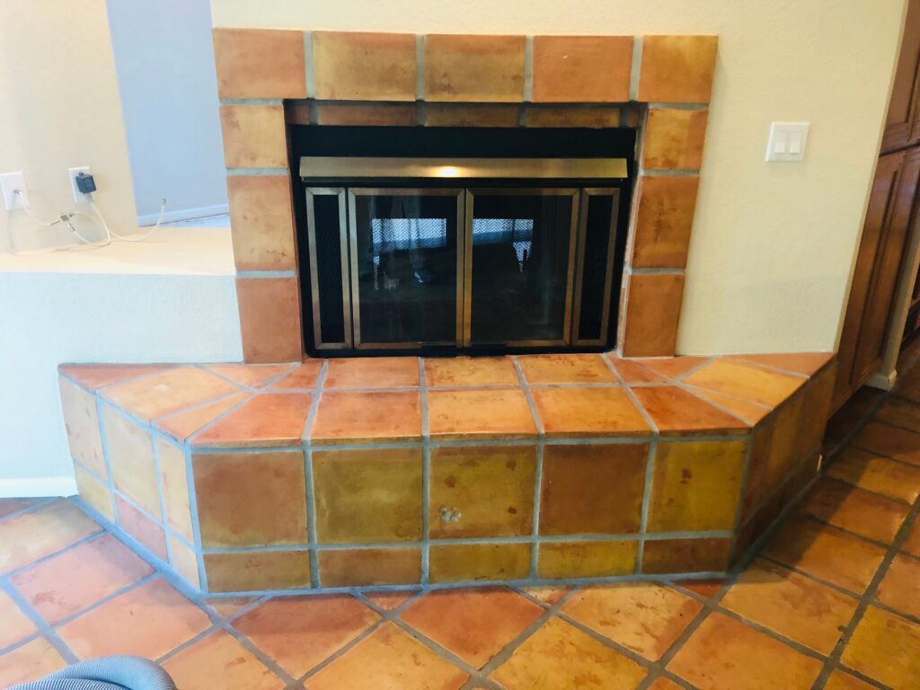 before and after tile removal in fireplace