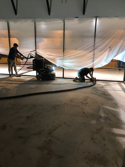 contractors removing tile in a commercial building
